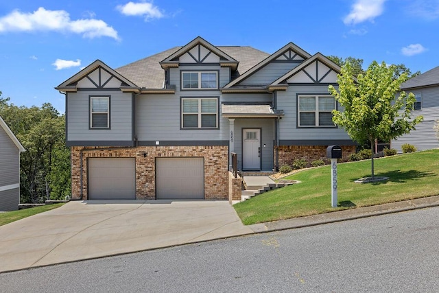 6859 Steep Hl, Ooltewah, TN 37363 - view of front of home with brick siding, concrete driveway, a front yard, and a garage