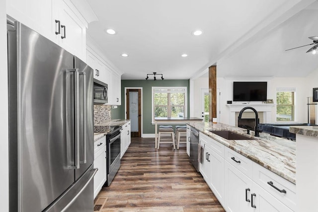 6859 Steep Hl, Ooltewah, TN 37363 - kitchen with stainless steel appliances, healthy amount of natural light, dark wood finished floors, recessed lighting, and a ceiling fan