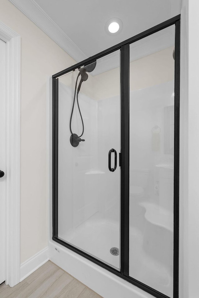 6859 Steep Hl, Ooltewah, TN 37363 - full bathroom featuring a stall shower, wood finished floors, and ornamental molding