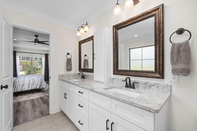 6859 Steep Hl, Ooltewah, TN 37363 - ensuite bathroom featuring double vanity, a ceiling fan, and ornamental molding