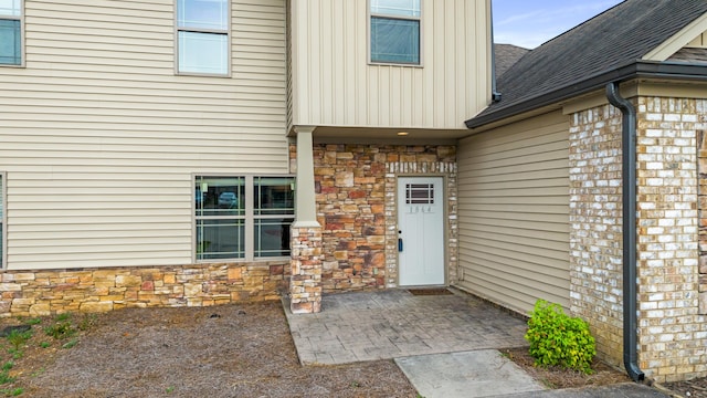 1864 Gate Tower Way NE, Cleveland, TN 37312 - entrance to property with roof with shingles, stone siding, and board and batten siding