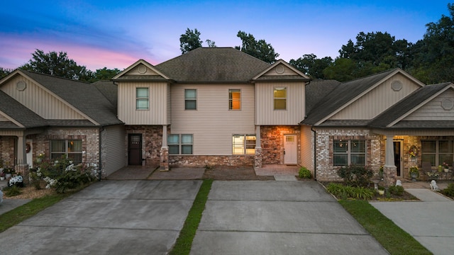 1864 Gate Tower Way NE, Cleveland, TN 37312 - view of front facade featuring stone siding, a shingled roof, and board and batten siding