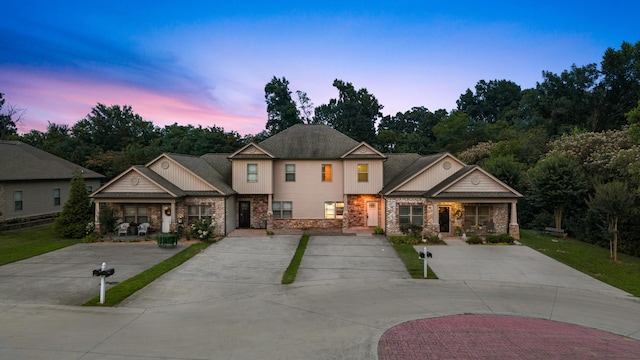 1864 Gate Tower Way NE, Cleveland, TN 37312 - craftsman-style house with stone siding, covered porch, and a front yard