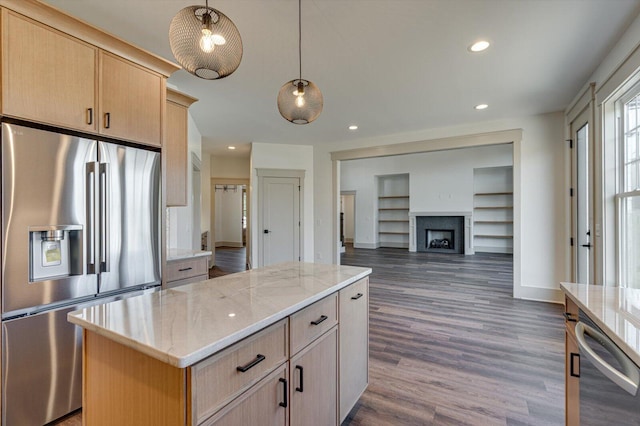 7104 Paxton Cir, Hixson, TN 37343 - kitchen with appliances with stainless steel finishes, light brown cabinetry, light stone counters, a center island, and recessed lighting