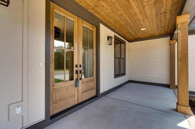 7104 Paxton Cir, Hixson, TN 37343 - property entrance with french doors, covered porch, and board and batten siding