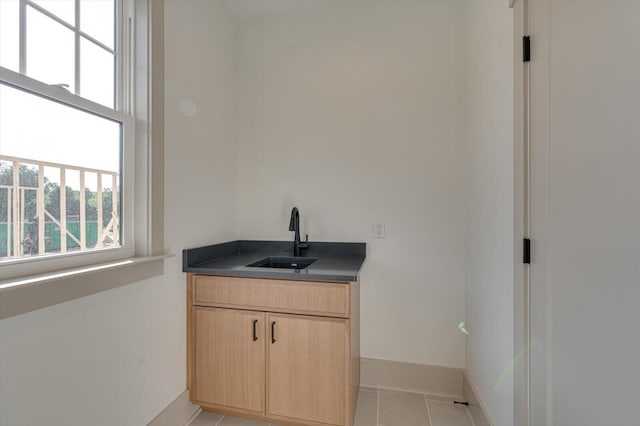 7104 Paxton Cir, Hixson, TN 37343 - bar featuring a sink and light tile patterned floors