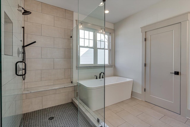 7104 Paxton Cir, Hixson, TN 37343 - bathroom with a stall shower, a freestanding tub, and tile patterned flooring