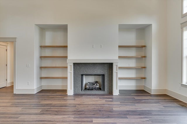 7104 Paxton Cir, Hixson, TN 37343 - unfurnished living room with dark wood-type flooring and a fireplace