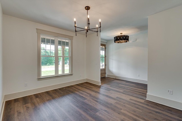 7104 Paxton Cir, Hixson, TN 37343 - spare room featuring a chandelier and dark wood-style flooring