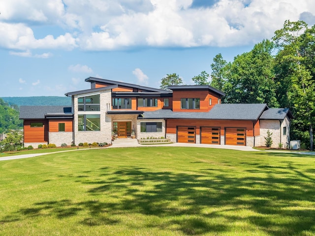 1034 Montlake Rd, Soddy Daisy, TN 37379 - contemporary house with stone siding, a front lawn, and a garage