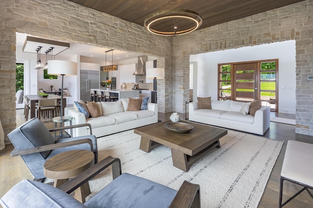1034 Montlake Rd, Soddy Daisy, TN 37379 - living area with dark wood finished floors, a towering ceiling, healthy amount of natural light, and wood ceiling