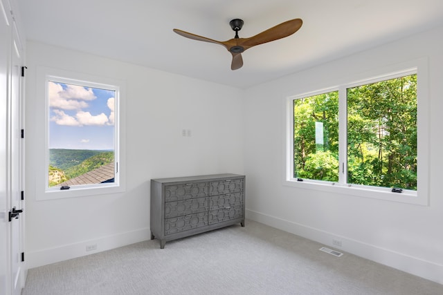 1034 Montlake Rd, Soddy Daisy, TN 37379 - unfurnished bedroom featuring multiple windows, carpet, and ceiling fan