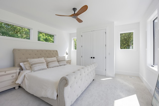 1034 Montlake Rd, Soddy Daisy, TN 37379 - bedroom with light carpet, a ceiling fan, and a closet
