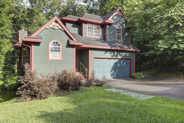 9028 Warbler Ln, Chattanooga, TN 37421 - victorian home with driveway, a chimney, an attached garage, and a front yard