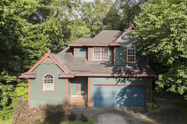 9028 Warbler Ln, Chattanooga, TN 37421 - victorian house with a garage, asphalt driveway, and a shingled roof
