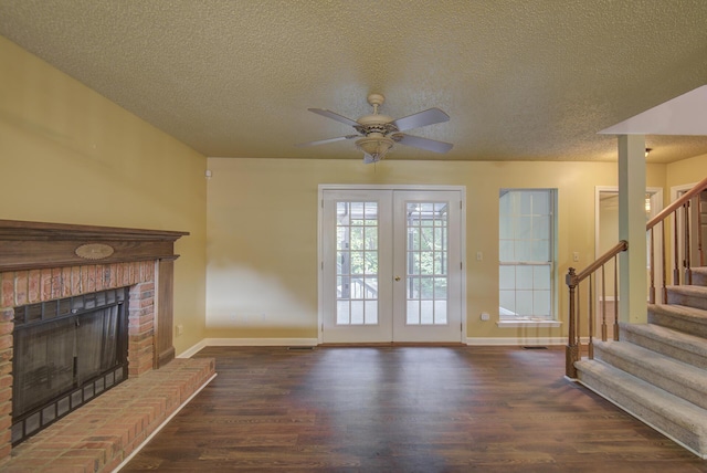 9028 Warbler Ln, Chattanooga, TN 37421 - unfurnished living room featuring wood finished floors, ceiling fan, stairway, a textured ceiling, and a fireplace