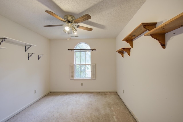 9028 Warbler Ln, Chattanooga, TN 37421 - spare room with light carpet, a ceiling fan, and a textured ceiling