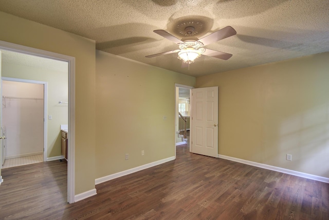 9028 Warbler Ln, Chattanooga, TN 37421 - spare room with dark wood-type flooring, a ceiling fan, and a textured ceiling