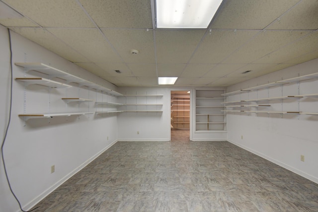 9028 Warbler Ln, Chattanooga, TN 37421 - basement featuring baseboards and a drop ceiling