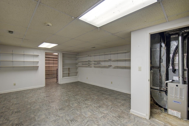 9028 Warbler Ln, Chattanooga, TN 37421 - basement with a paneled ceiling and heating unit