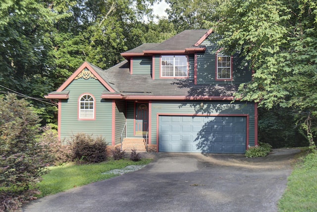 9028 Warbler Ln, Chattanooga, TN 37421 - view of front of home with driveway, a garage, and roof with shingles