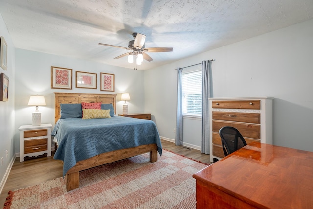 171 Gentry Rd, Ringgold, GA 30736 - bedroom featuring wood finished floors, ceiling fan, and a textured ceiling