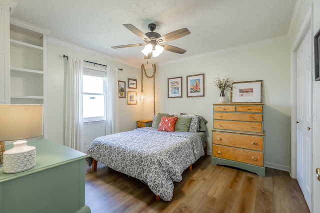 171 Gentry Rd, Ringgold, GA 30736 - bedroom featuring wood finished floors, a closet, ornamental molding, and a ceiling fan