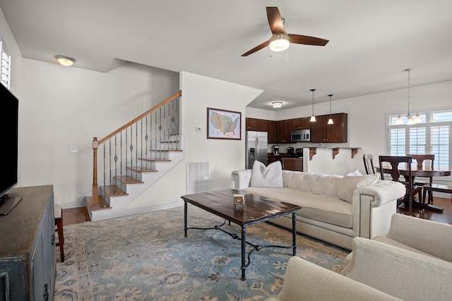509 E 16th St, Chattanooga, TN 37408 - living area featuring ceiling fan, stairs, a chandelier, and wood finished floors