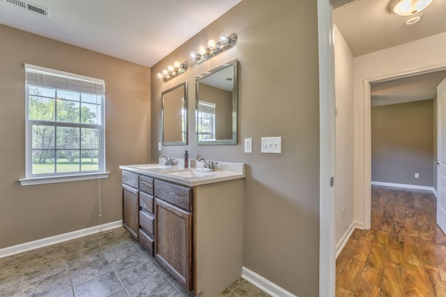 4976 Stewart Rd, Tunnel Hill, GA 30755 - bathroom featuring double vanity and baseboards