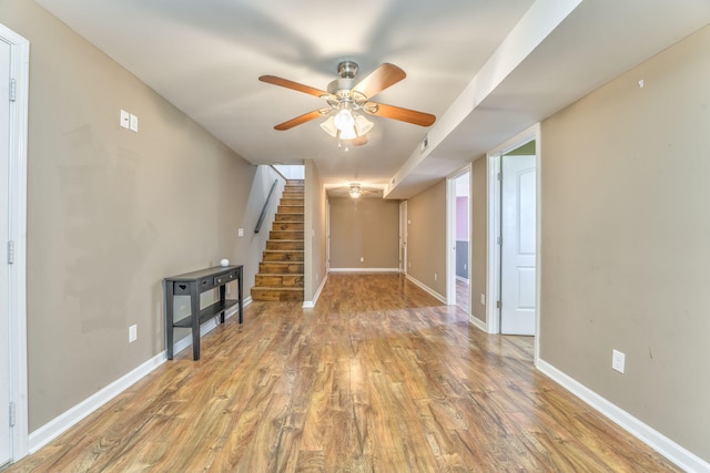 4976 Stewart Rd, Tunnel Hill, GA 30755 - unfurnished living room with light wood-style floors, a ceiling fan, and stairway