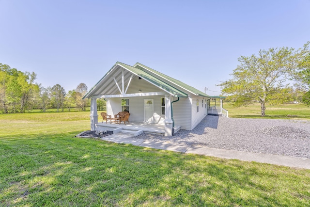 4976 Stewart Rd, Tunnel Hill, GA 30755 - rear view of house featuring a yard and a porch