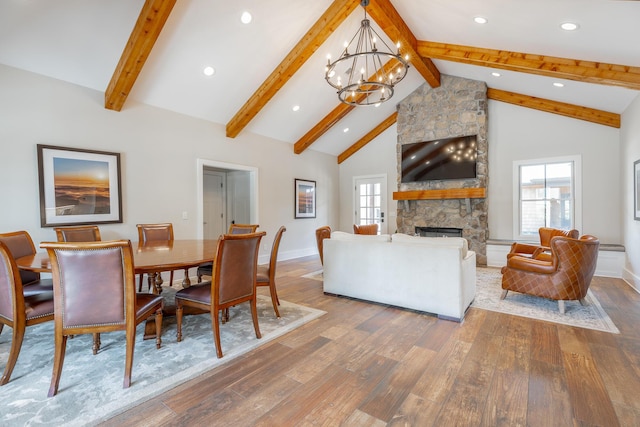 8 Heather Ln, Rising Fawn, GA 30738 - dining space featuring wood finished floors, a chandelier, a fireplace, beamed ceiling, and recessed lighting