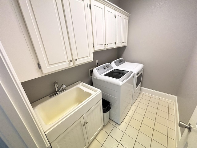 6419 Camdendown Ln, Hixson, TN 37343 - laundry room with independent washer and dryer, cabinet space, and light tile patterned flooring