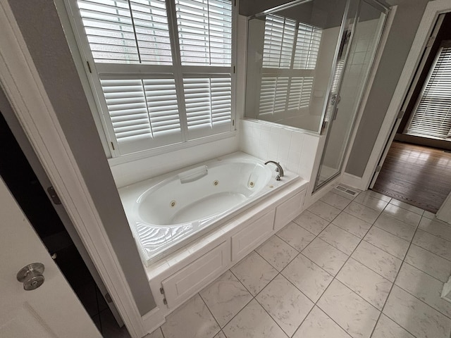 6419 Camdendown Ln, Hixson, TN 37343 - bathroom with a tub with jets, a shower stall, and marble look tile flooring