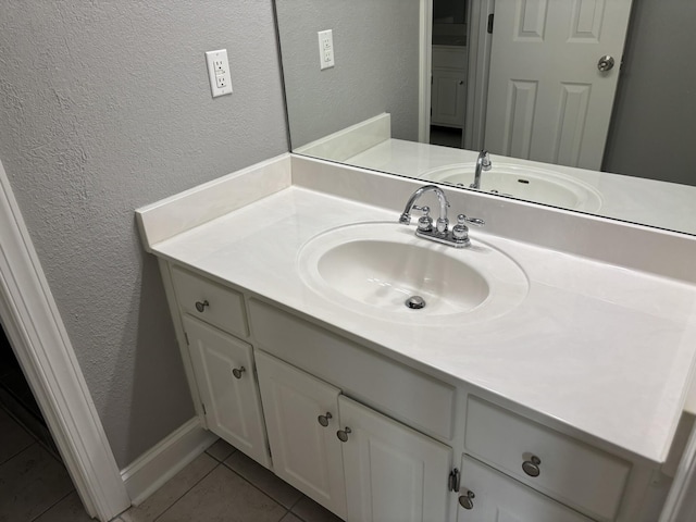 6419 Camdendown Ln, Hixson, TN 37343 - bathroom with a textured wall, tile patterned floors, and vanity