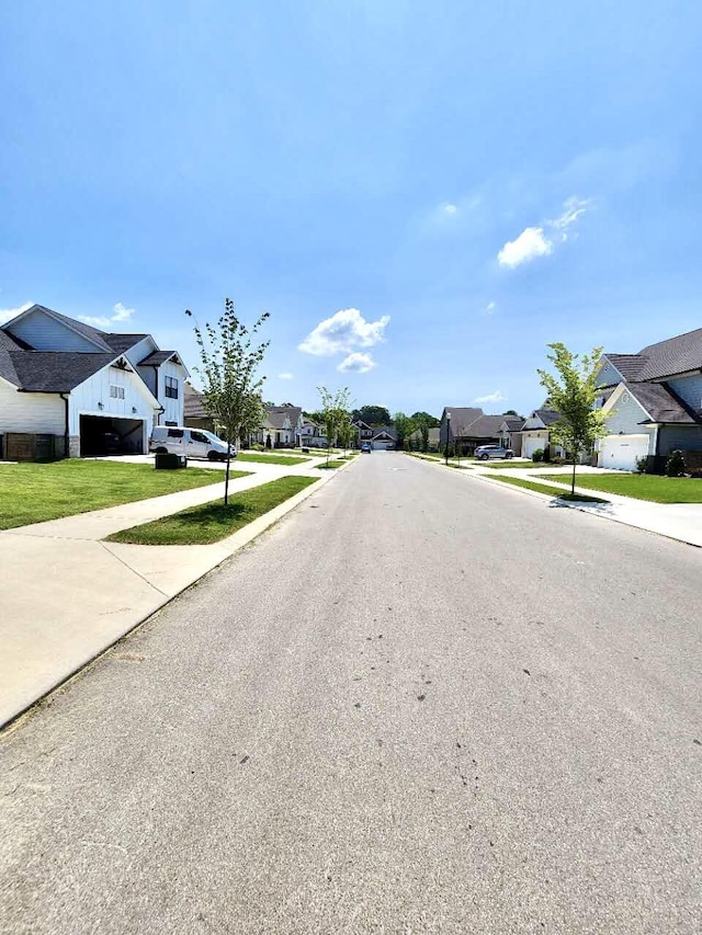 8127 Slugger Way, Chattanooga, TN 37421 - view of asphalt road featuring a residential view, sidewalks, and curbs