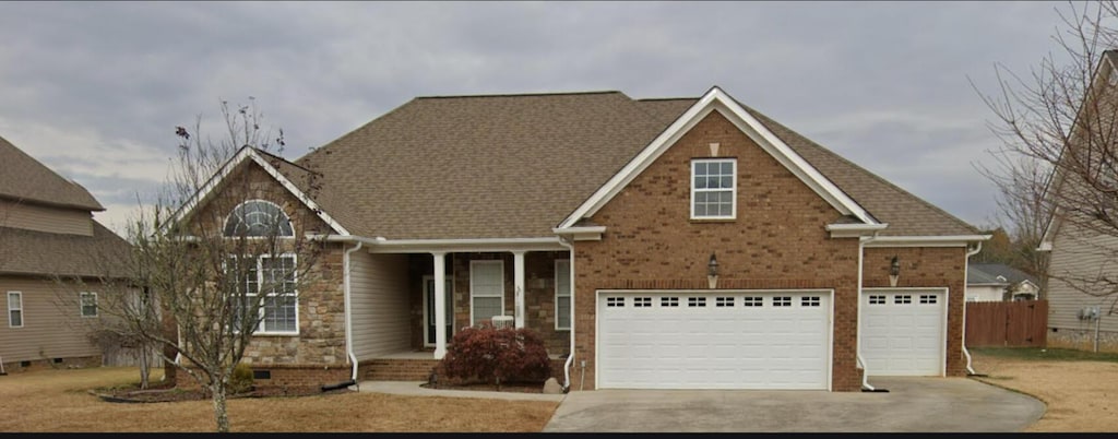 7406 Nightfall Cir, Ooltewah, TN 37363 - traditional-style home with driveway, an attached garage, and brick siding