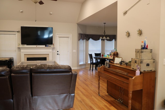 7354 Kayla Beth Ct, Ooltewah, TN 37363 - living area with ceiling fan, light wood-type flooring, a fireplace, and lofted ceiling