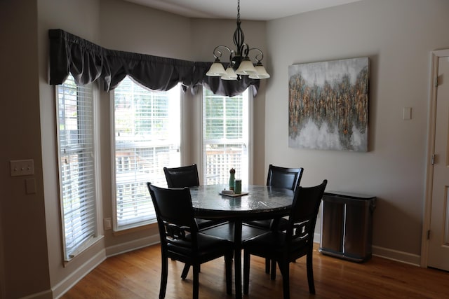 7354 Kayla Beth Ct, Ooltewah, TN 37363 - dining area featuring a chandelier and wood finished floors