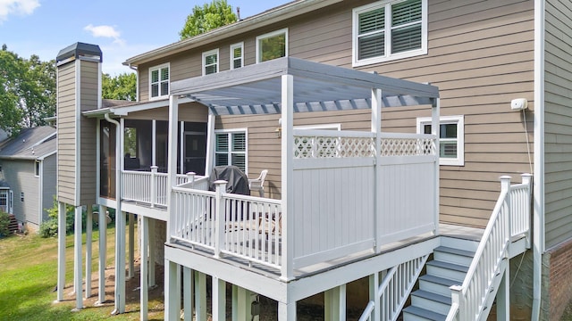 8014 Woodstone Dr, Hixson, TN 37343 - rear view of house with stairs, a sunroom, and a chimney