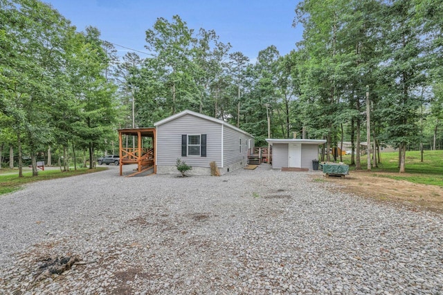 1165 Hugh Allison, Pikeville, TN 37367 - view of front of home featuring view of scattered trees, crawl space, an outbuilding, and driveway