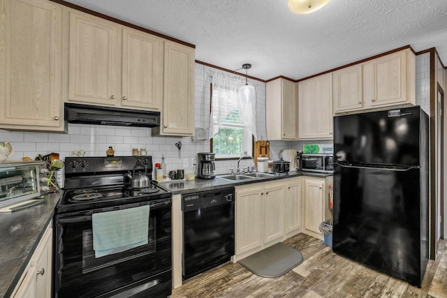 1165 Hugh Allison, Pikeville, TN 37367 - kitchen with black appliances, under cabinet range hood, dark countertops, backsplash, and wood finished floors