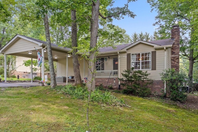 1018 Ridgeway Ave, Signal Mountain, TN 37377 - ranch-style home featuring a chimney, a front lawn, an attached carport, and a porch