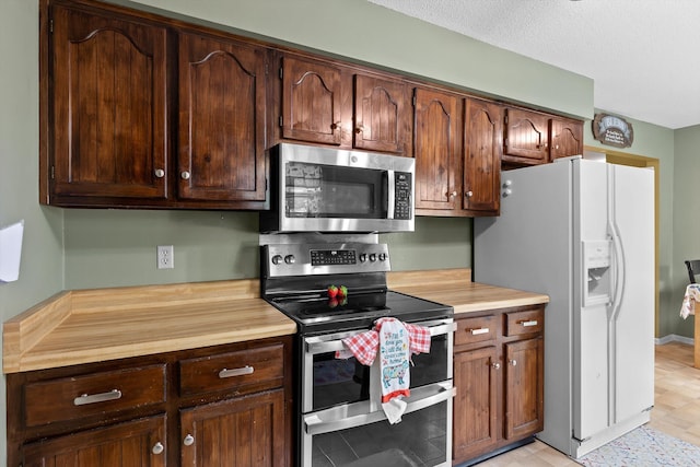 1018 Ridgeway Ave, Signal Mountain, TN 37377 - kitchen featuring stainless steel appliances and dark brown cabinetry