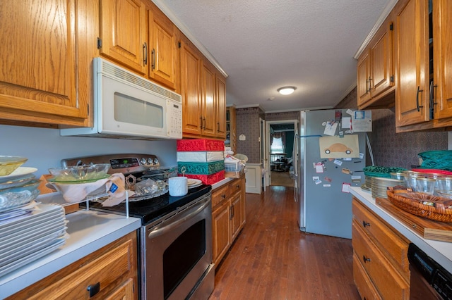 200 Whippoorwill Ln, Lafayette, GA 30728 - kitchen with stainless steel appliances, dark wood-style flooring, brown cabinetry, and a textured ceiling