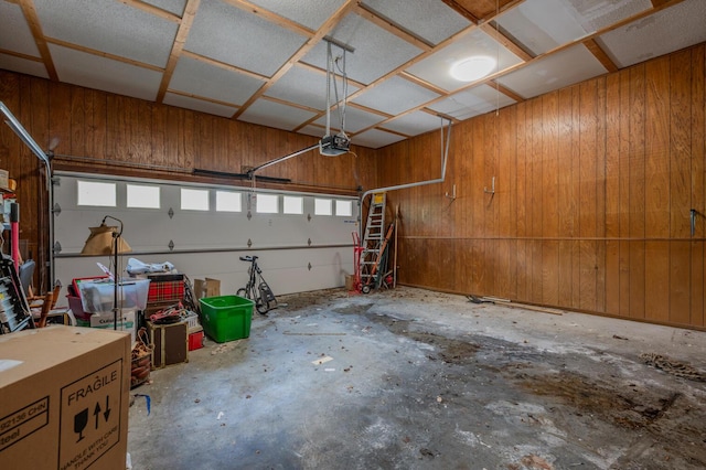 200 Whippoorwill Ln, Lafayette, GA 30728 - garage featuring wooden walls and a garage door opener