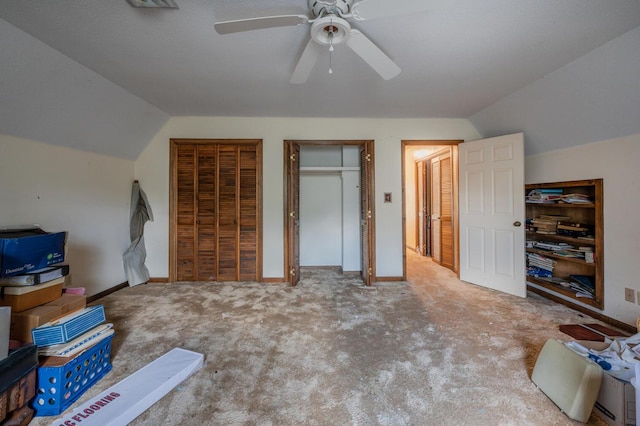 200 Whippoorwill Ln, Lafayette, GA 30728 - unfurnished bedroom with vaulted ceiling, two closets, carpet flooring, and ceiling fan