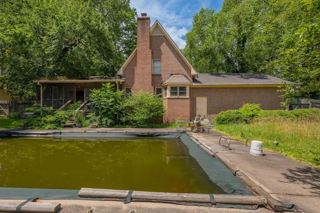 200 Whippoorwill Ln, Lafayette, GA 30728 - rear view of house with a chimney and brick siding