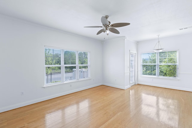 3102 Regency Ct, Chattanooga, TN 37421 - empty room featuring healthy amount of natural light, light wood-style floors, ceiling fan, and crown molding