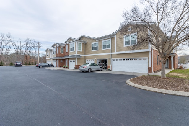 3102 Regency Ct, Chattanooga, TN 37421 - view of front facade with an attached garage, brick siding, and driveway